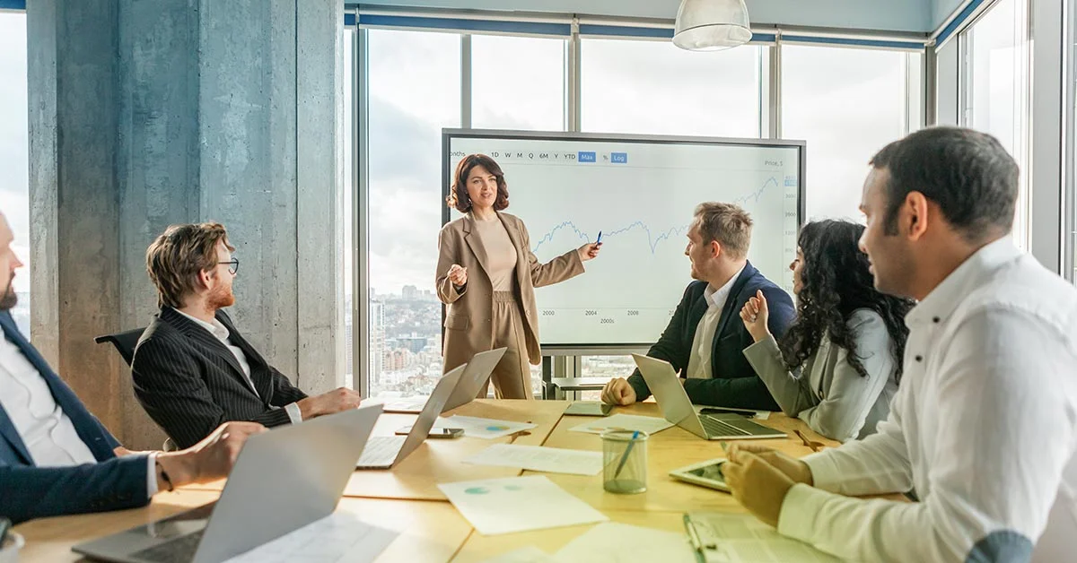 Business professionals collaborating in a meeting room, demonstrating effective communication and teamwork.