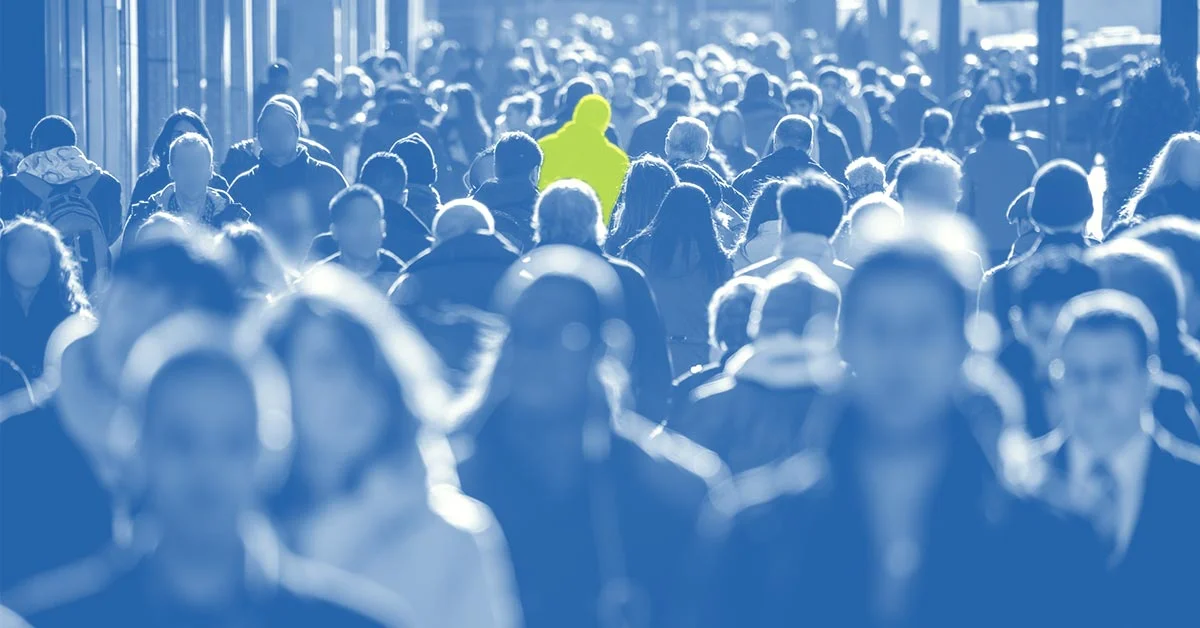 Crowd scene with one person highlighted to represent the unique focus of rare disease clinical trials and patient identification challenges.
