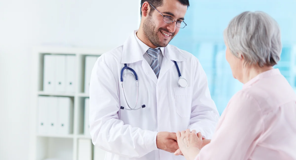 Doctor building trust with a patient—illustrating the importance of communication in improving clinical trial recruitment.